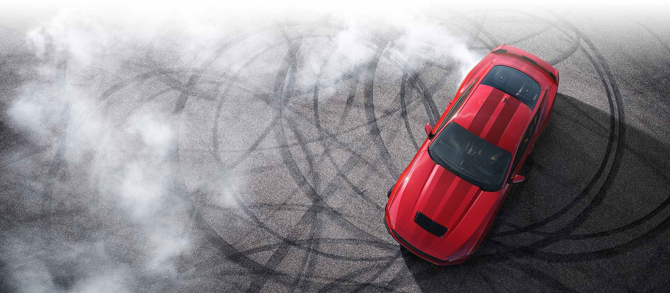 Overhead view of a 2024 Ford Mustang® model with tire tracks on pavement | Weakley County Motors, Inc. in Martin TN