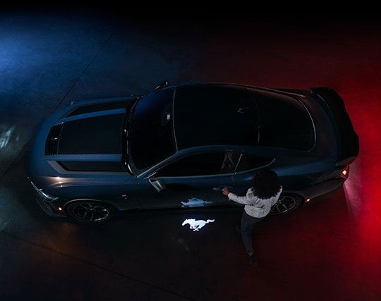 2024 Ford Mustang® Dark Horse™ model with a driver approaching the vehicle | Weakley County Motors, Inc. in Martin TN