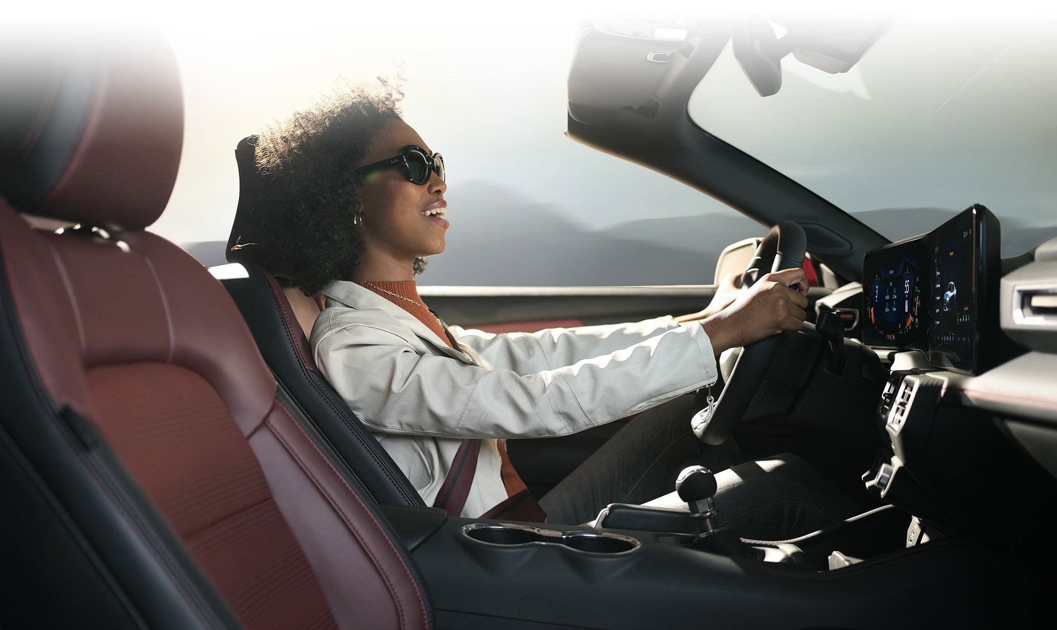 Person sitting in the driver’s seat of a 2024 Ford Mustang® convertible | Weakley County Motors, Inc. in Martin TN