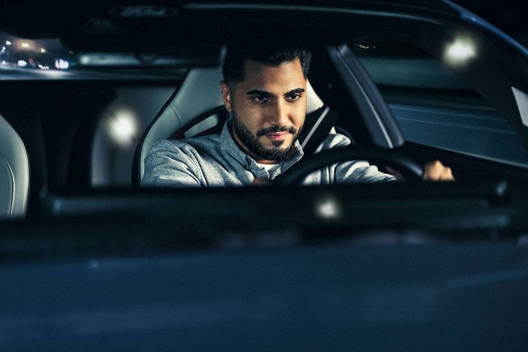 Person sitting in the driver’s seat of a parked 2024 Ford Mustang® coupe | Weakley County Motors, Inc. in Martin TN